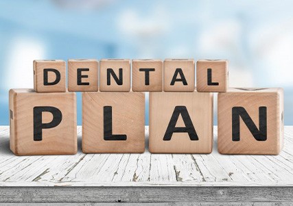 Blocks spell “dental plan”