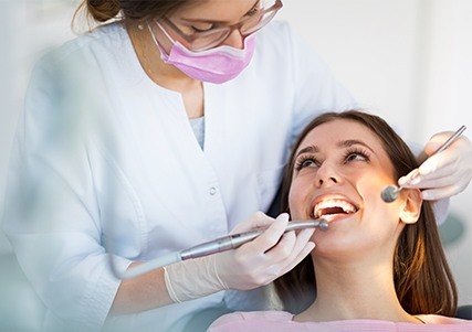 Woman receiving dental exam