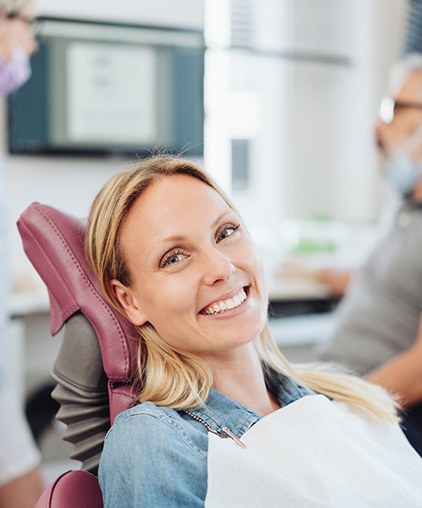 Woman smiling in the dental chair