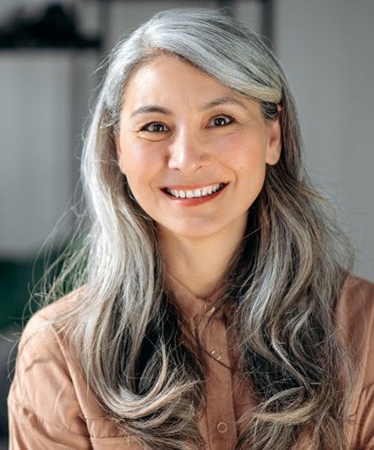 a woman smiling while at home