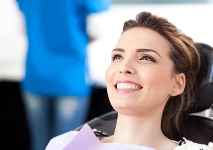 woman smiling in the dental chair