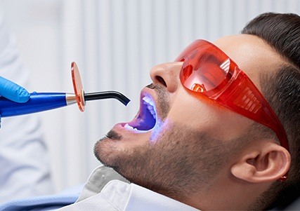 Man receiving dental bonding treatment