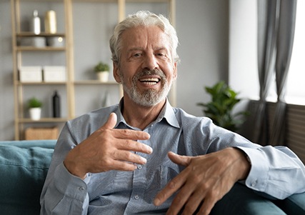 An older speaking with someone off-camera