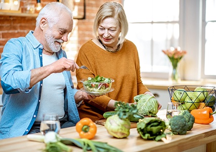 Seniors making a salad