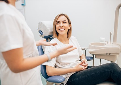 patient talking to dentist in Saginaw 