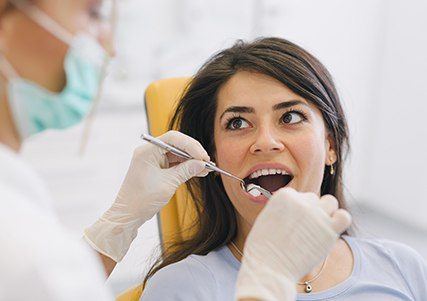 Woman receiving dental exam