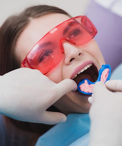 Woman receiving fluoride treatment 