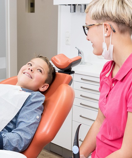 Young boy smiling at dentist’s office