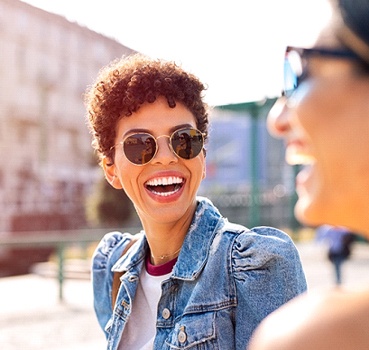 Friends laughing together outside