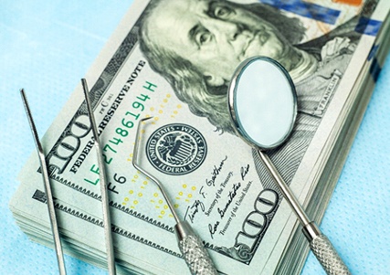 Dental instruments on money