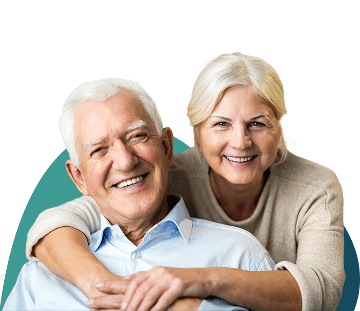 Smiling older man and woman holding each other