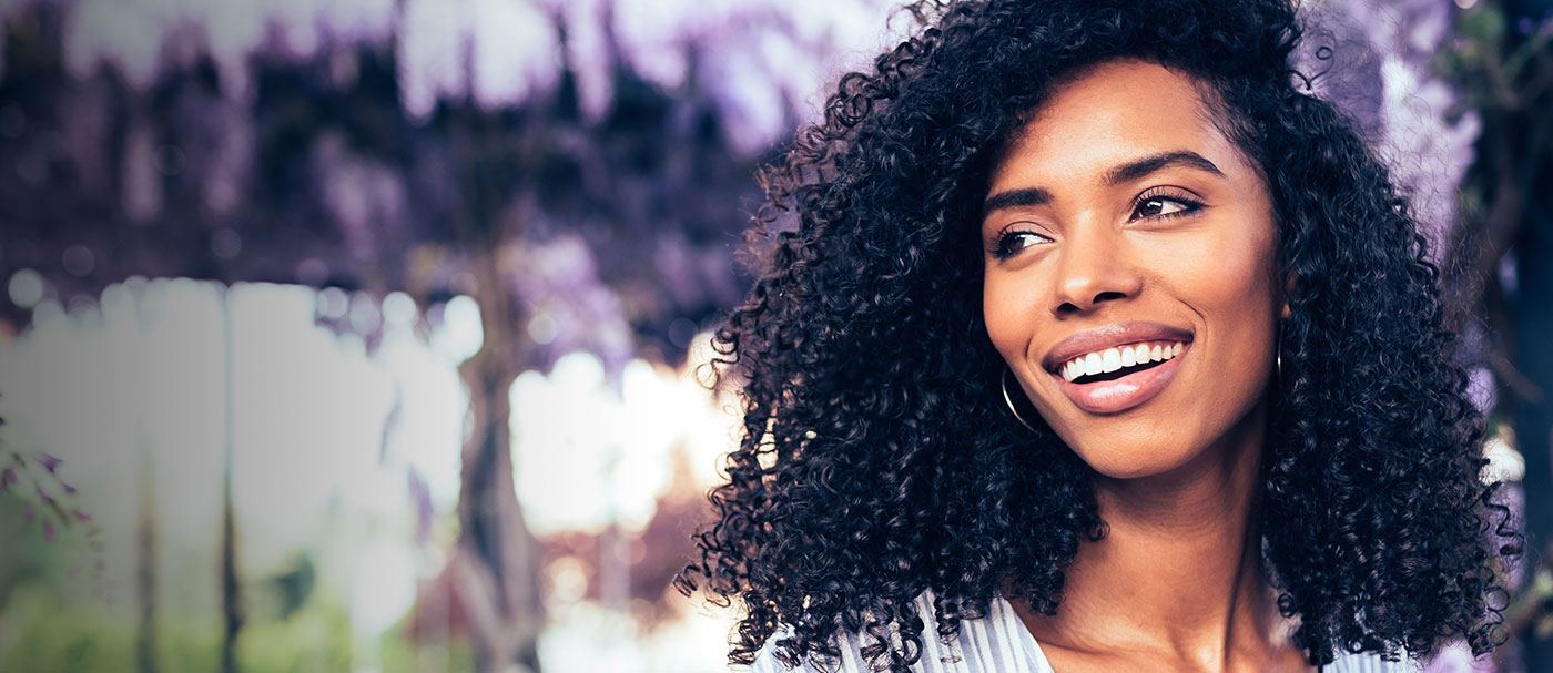 Smiling woman looking off into the distance