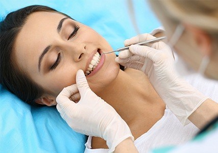 Woman receiving dental treatment