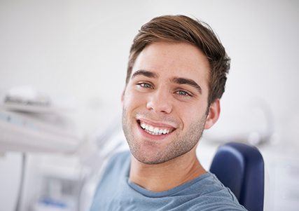 Smiling man in dental chair