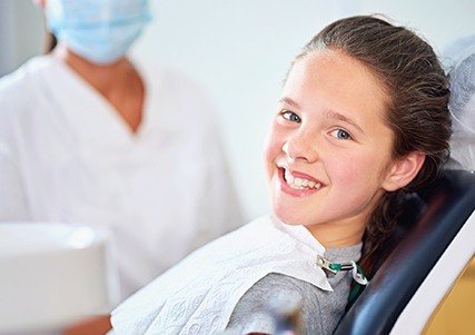 Smiling child in dental chair