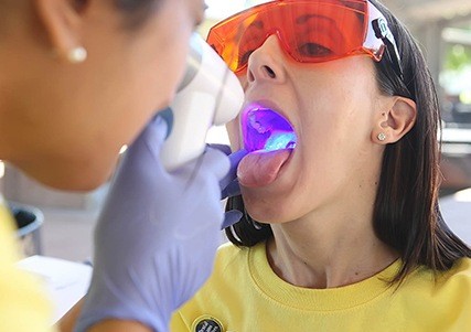 Patient receiving oral cancer screening