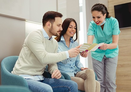 dental patients discussing the cost of root canal treatment