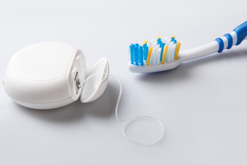 Toothbrush and floss