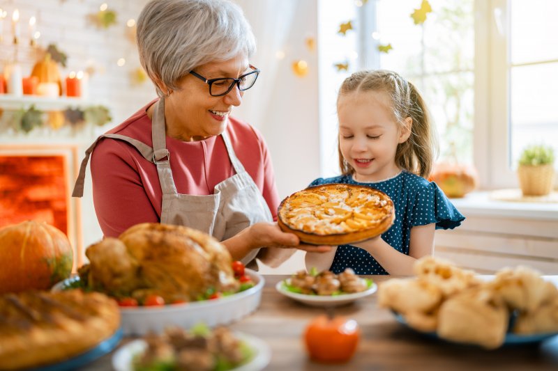 Woman with dentures at Thanksgiving dinner