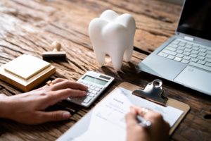 a patient filling out a dental insurance form