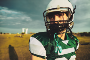 a closeup of a football player wearing a helmet