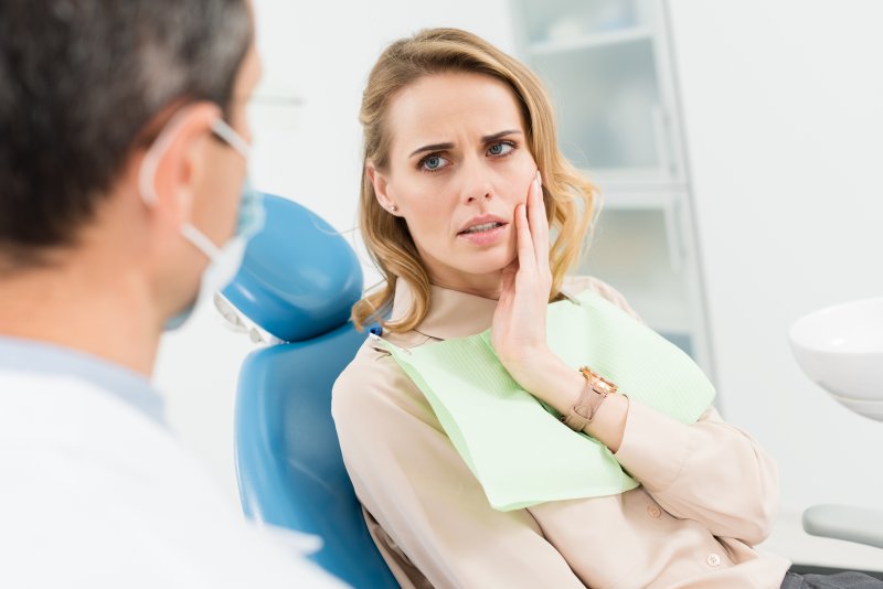 Patient talking to dentist about needing a root canal