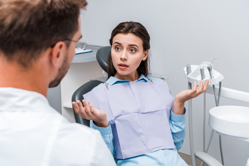 Patient talking to dentist about gum disease